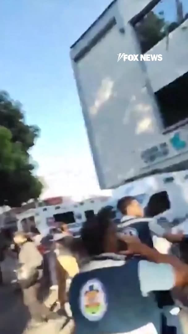 Debris rains down from an emergency services building in Cali, Colombia, as a powerful 7.4 magnitude earthquake rocks the region. Pieces of the structure crash onto ambulances parked outside while bystanders scramble away from the building. Colombia's geological service says the quake struck at a depth of 96 km, about 60 miles. The country's disaster management agency is now working with local authorities to assess potential damage.