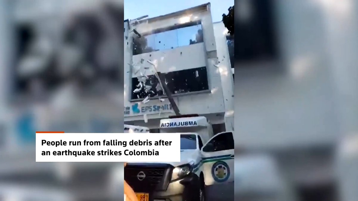 People flee falling debris in the early moments of a powerful earthquake in western Colombia, which brought down buildings across several cities and left others trapped in the rubble, local authorities said