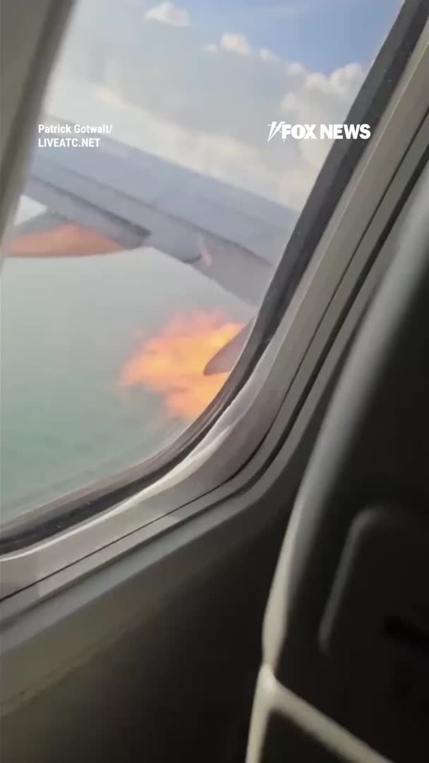 Flames shoot from an American Airlines jet engine moments after it strikes birds during takeoff from Myrtle Beach, forcing the pilot to declare a mayday. The Boeing 737 quickly turns back as crews prepare for an emergency response on the ground. The plane lands safely with all 181 passengers safe after the midair scare.