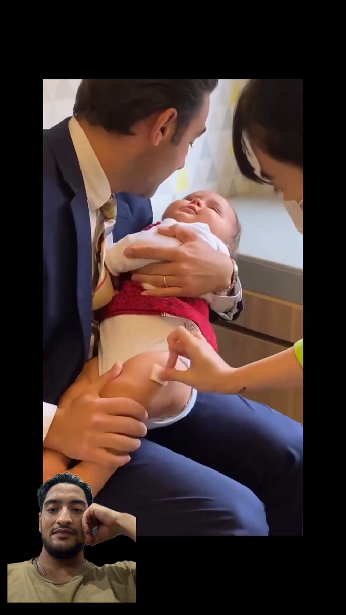 baby got the shot and barely noticed. just sat in dad’s arms like nothing else was happening