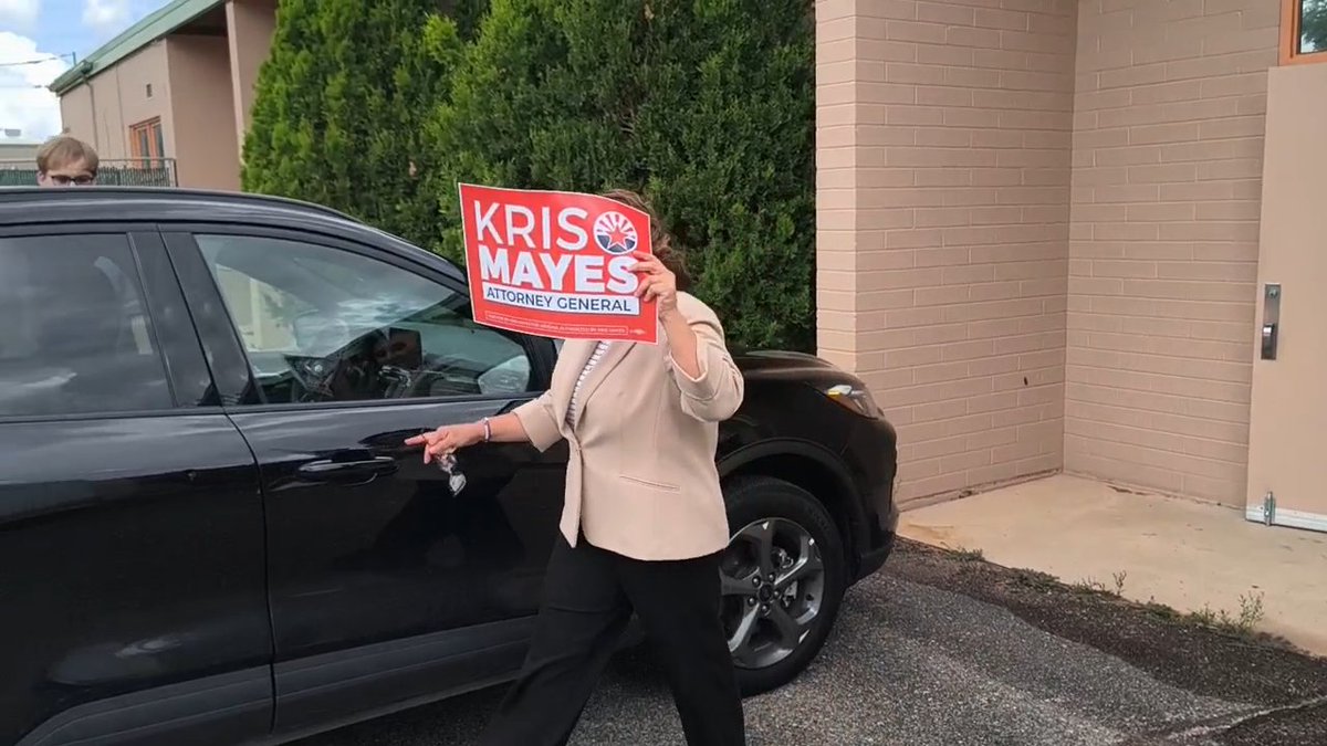 Shameful. Arizona Democrat lobbyist Joanna JoAnna Mendoza literally HID her FACE behind a Kris Mayes campaign sign... & refused to answer questions about cheating taxpayers out of money meant for public schools. WATCH 🎥