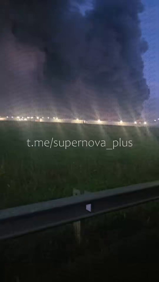 Muscovites in Koledino watch their local Wildberries distribution center burn down following a Ukrainian drone attack.