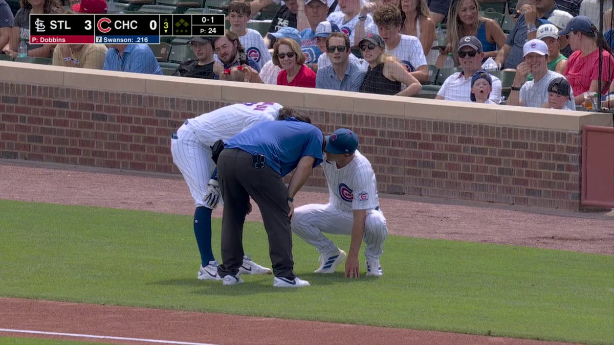 Chicago Cubs SS Dansby Swanson left the game with an injury after an awkward swing.