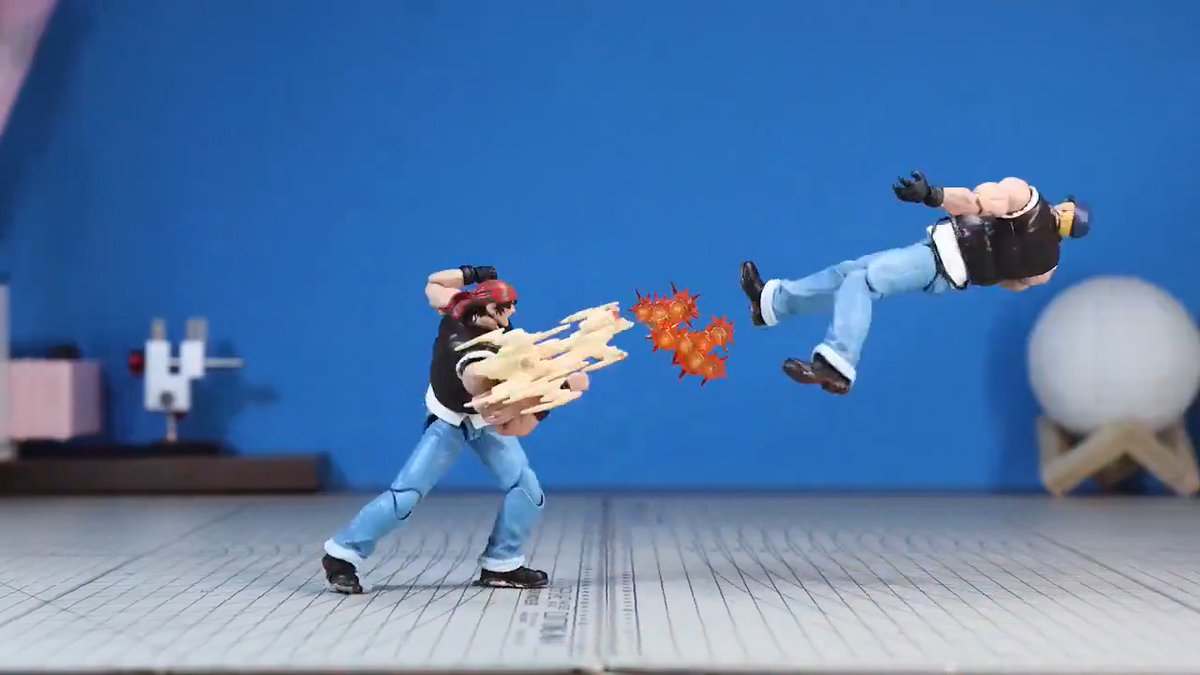 This painstaking frame-by-frame stop-motion King of Fighters animation was designed by Storm Collectibles: Using articulated 1/12 scale action figures, it features the Ikari team (Ralf & Clark, Leona) versus heroes Kyo, Benimaru and Daimon, shot on a tabletop setup and finished with digital effects. Classic stop-motion techniques involve a fixed camera (or locked-off phone/DSLR), set to capture one photo per frame. Incremental pose changes create the motion—while supports/rigs (wires, stands, or clips) hold figures in dynamic airborne or impact poses; these are visible in some raw-looking frames and are typically painted out or masked later. Controlled lighting (softboxes/lamps visible in the wider shots) keeps exposure consistent across hundreds of frames. A 42-second clip like this requires hundreds to over a thousand individual photographs. Animators often use onion-skinning software (Dragonframe or free equivalents) to reference the previous frame while posing the next. Joint limitations of the figures are worked around by careful articulation, sometimes swapping parts or using replacement pieces for extreme poses.