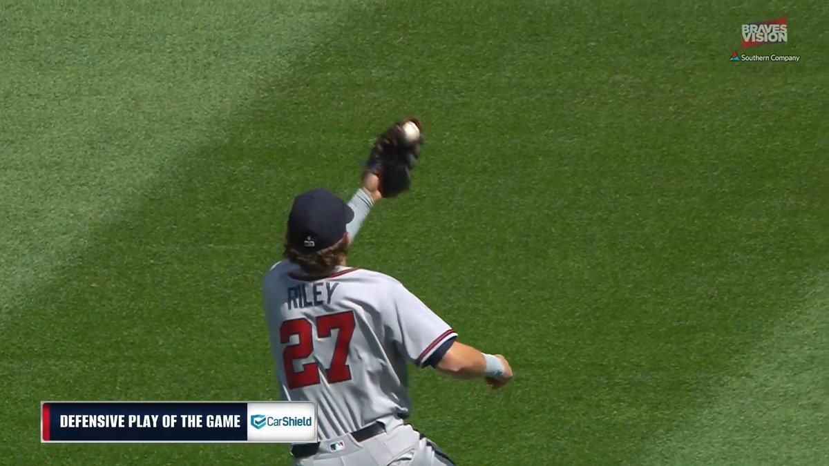 Austin Riley makes an over-the-shoulder grab on the outfield grass!