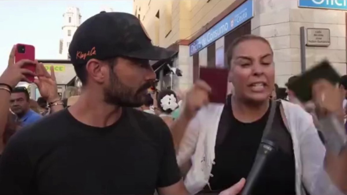 A crazy woman screams that more migrants should be welcomed into Europe "IN MY HEART I'M A MOROCCAN" What is wrong with these people?