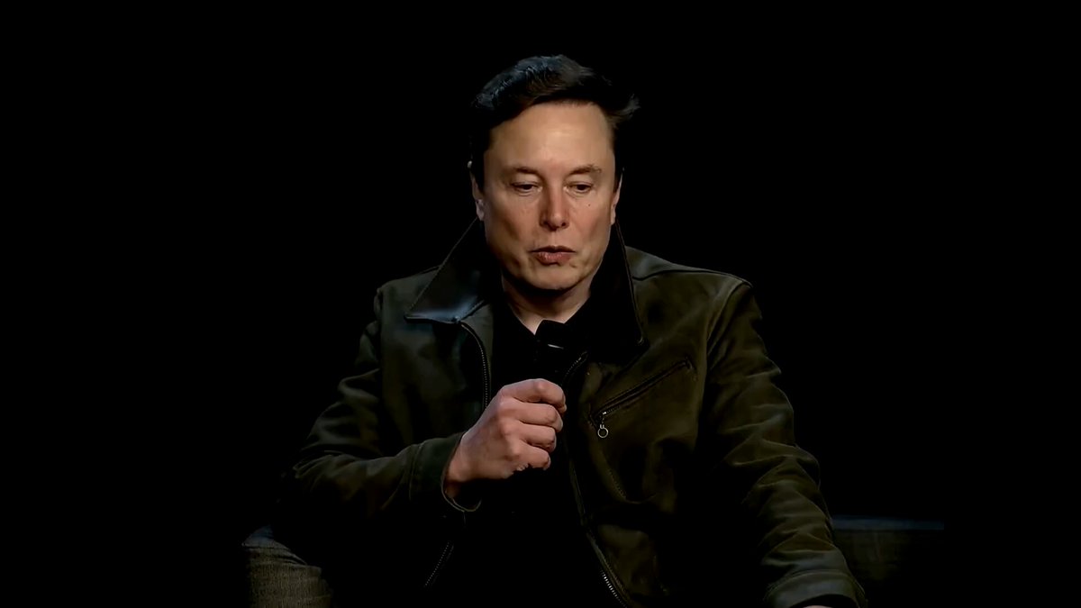 Elon Musk just merged his two biggest bets into one machine, and neither Tesla nor xAI has said its name yet. $2,000,000,000. That's what Tesla put into xAI. Not a partnership announcement. A skeleton. Tesla builds the body. Cameras, arms, legs, motor control. xAI builds the mind. Language, reasoning, planning. Split the same way your nervous system is split. Brain decides. Spine executes. A language model can't fire a motor directly. Grok proposes "move the table." Optimus checks for a kid nearby first. Intelligence on top, safety layer underneath. Reuters flagged the plan back in 2025. Grok, considered for integration into Optimus. Nobody believed it yet. 2026 changed that. MacroHard shipped. Grok already runs as a high-level navigator for an AI agent doing digital work. Reuters called it a digital employee. Digital half: done. Physical half: Optimus. Musk hasn't confirmed the merge. He hasn't needed to. The internal name floating around is Grok Gen 1. Not announced. Not denied. You'll stop opening the app. You'll say "Grok, help me." And it'll walk over.