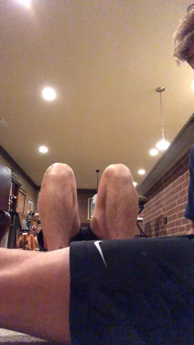 Massaging friends boy feet