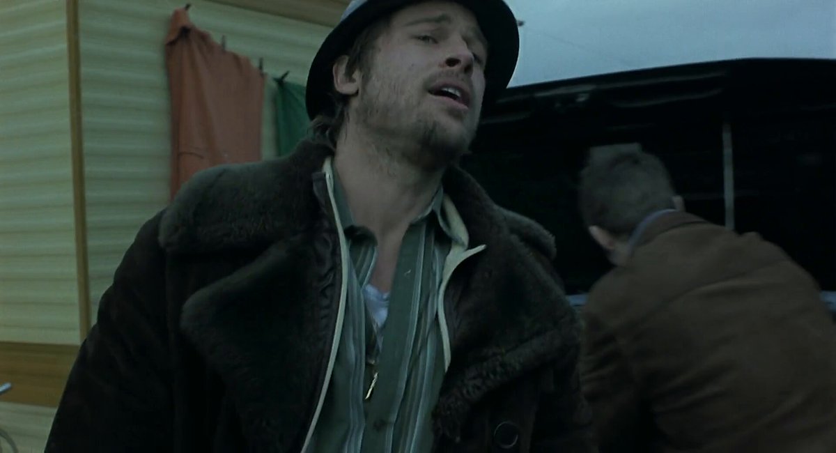 After completing "Fight Club" (1999), Brad Pitt felt that he had done a movie which he thought was too commercial. He became interested in watching the movie of new filmmakers. He was impressed by "Lock, Stock and Two Smoking Barrels" (1998). So, Pitt called Guy Ritchie up and said, “Hey, I really like what you’re doin’, and if there’s anything that I could fit in, then let’s talk.” Ritchie said, “Well, there is.” And I said, Great! I’m in!” However, both of them panicked before the filming of "Snatch" (2000) started because of the dialect, which was unintelligible. Pitt worked on the accent and tried to be clear and understood. It wasn't working. Pitt went to Ritchie, the day before the shoot and I said, “Guy, I’m gonna f**k up your movie. You should do it.” [So that Pitt could pick up the accent from the imitation] He replied, “Oh, no. No, no, no, no, no.” Pitt, who was scheduled to be on the set 6 AM the next day was was walking the streets of North London like a maniac. Pitt's friend kept saying to him, “You can’t understand it.” At midnight, that clicked in , and Pitt called and woke up Guy Ritchie and said, Are you okay, if you can’t understand your beautifully written dialogue?” And he said, “Yep.” On his inspiration for the role, he credited Benicio Del Toro. "But also, I’ve gotta give credit to Benicio Del Toro, for his brilliant performance in 'The Usual Suspects' (1995). He was, to me, the first person that I’d seen, that was fearless with being unintelligible." ("SBIFF 2020 - Brad Pitt Discusses "Thelma and Louise", 90's Films, "Seven" & "Fight Club"", YT, 2020) P.S: On this day, 26 years ago, "Snatch" (2000) premiered in the UK.