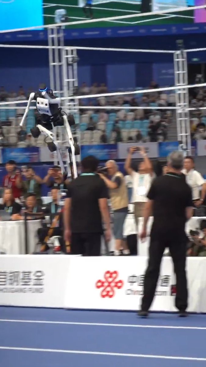 Swift recovery! At the 2nd #WHRG, a humanoid robot tumbled on long jump landing, yet quickly regained its footing. #WorldHumanoidRobotGames #HumanoidRobot #LongJump