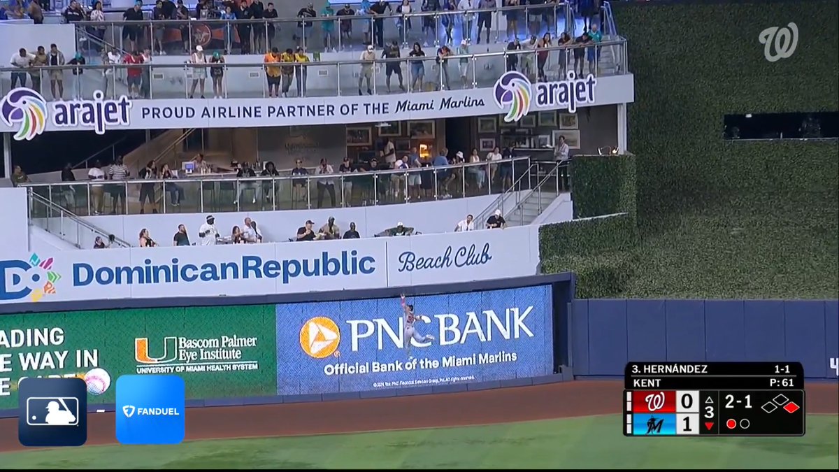 Jacob Young literally climbed the wall to make this play - AND he turned two! 🤯