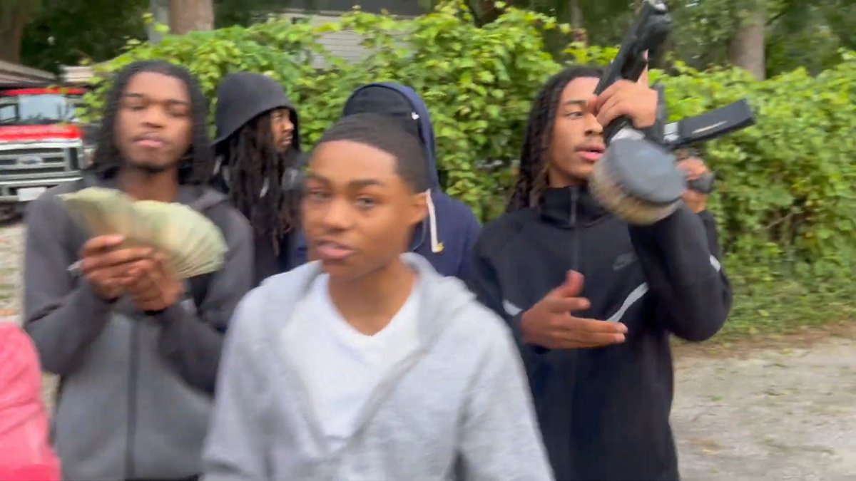Teenage gang members in Chicago suburb Hazel Crest IL doing a vlog posted outside flashing guns in broad daylight.