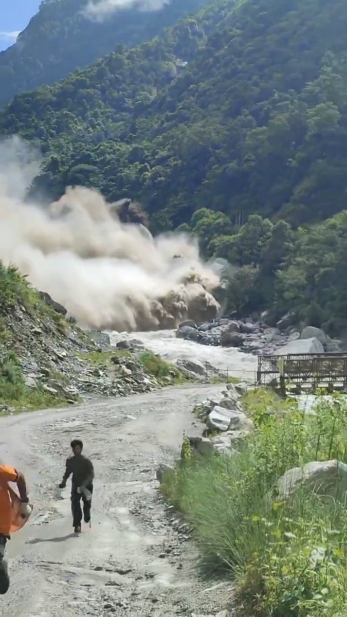 NEPAL FLOOD: TERRIFYING MOMENT CAUGHT ON CAMERA A sudden wall of floodwater surges through the Nepal-Tibet border region, sending people scrambling to escape as the disaster unfolds in seconds.