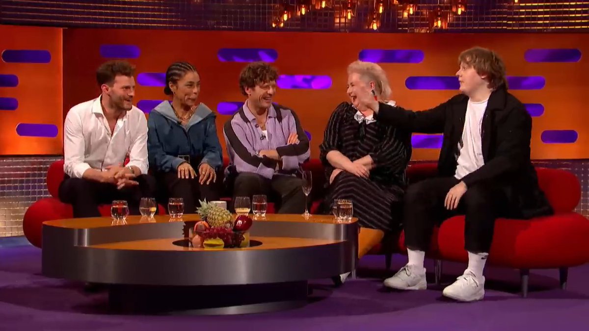Lewis Capaldi looked Jamie Dornan dead in the eye on national television and said it’s weird seeing him without a whip in his hand… then immediately followed it with and me without my cock in mine. The entire couch collapsed. Graham was gone. Jamie just had to sit there and take it. Only Capaldi could drop that line, still look like someone’s wholesome nephew, and leave the whole room needing a full reset. I’m still not over the delivery.