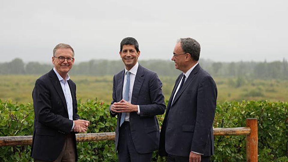 Federal Reserve Chairman Kevin Warsh leads fellow central bankers, Andrew Bailey, from the Bank of England, and Tiff Macklem, from the Bank of Canada, on a traditional walk at the Fed's annual gathering in Jackson Hole, Wyoming