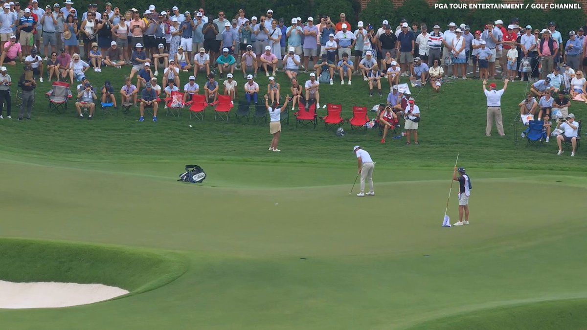 Cam Young drilled a WILD eagle putt on 18 to walk off with a share of the lead 🔥 Then he went for a handshake with his nonexistent playing partner 😂