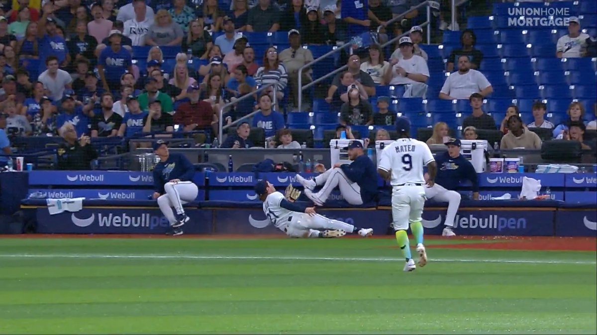 Jonny DeLuca goes sliding into the bullpen area to make the catch!