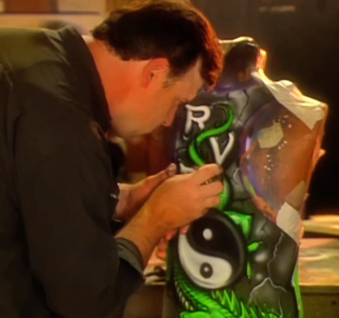 Rob Van Dam takes us behind the scenes with the artist who would airbrush his trademark in ring attire every time he had a match. The greatest video you will watch today 🔥