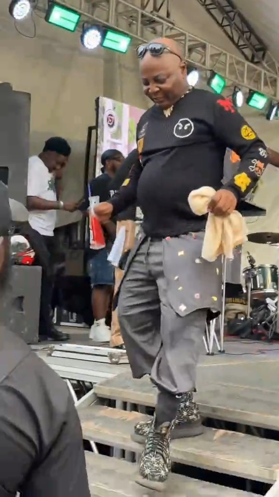 Charly Boy shows off amazing dancing moves on stage.
