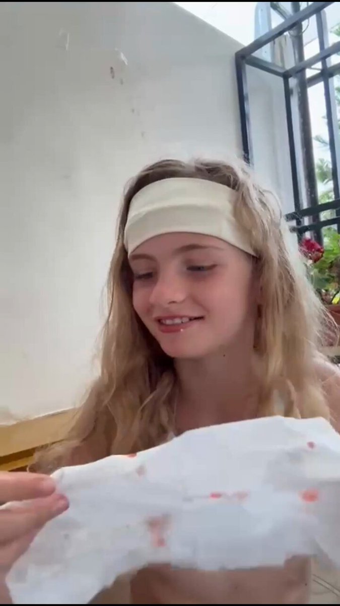 Lia Struggles removing her loose tooth
