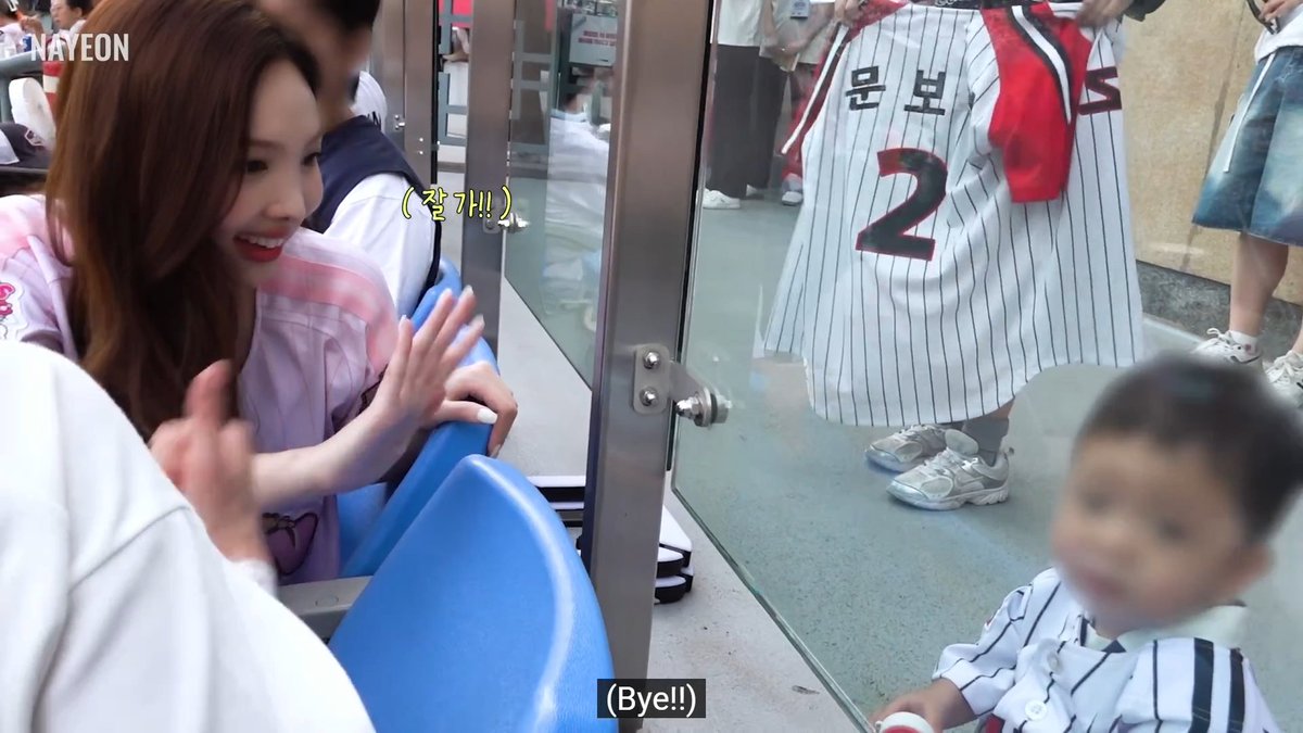 Nayeon playing with the baby and giving them a baby candybong 🥹