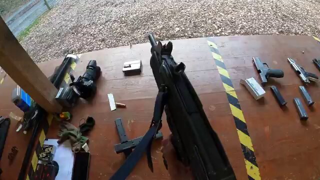 Rule number one of open bolt guns is to never try to clear a malfunction before cocking the gun all the way back