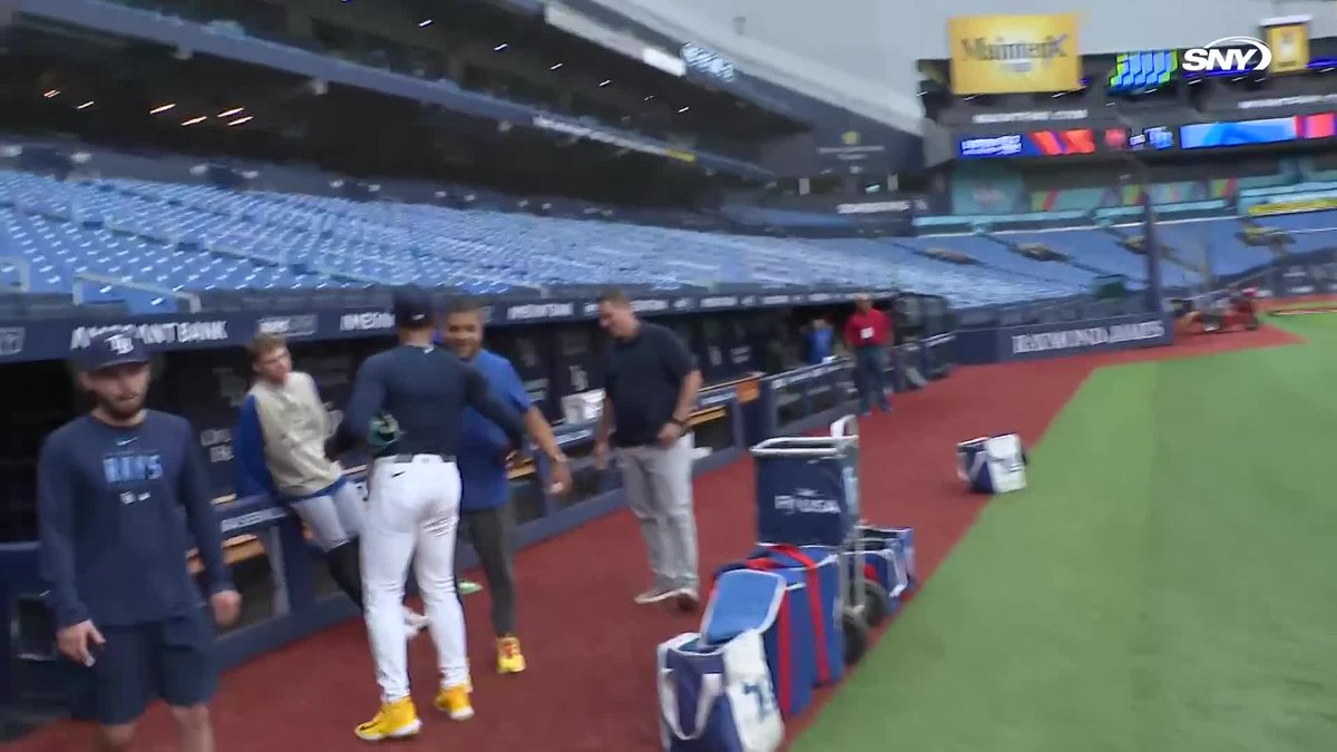 Freddy Peralta greets Carson Benge, Zac Thornton and other Mets staffers in Tampa Bay