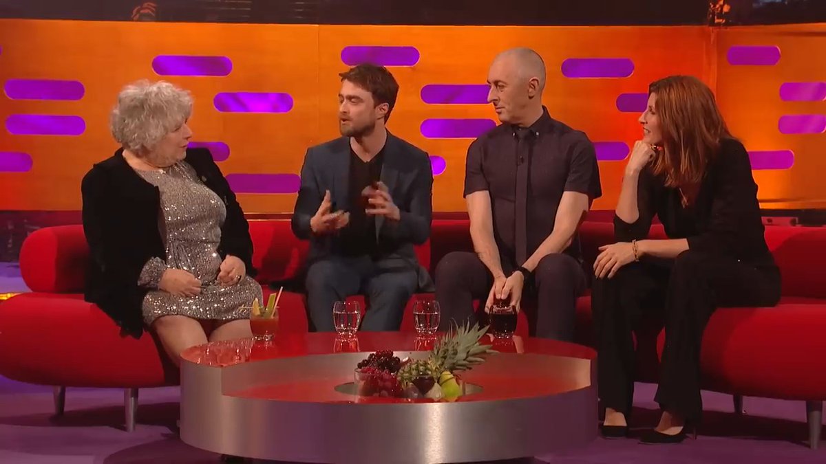 Daniel Radcliffe was sitting next to Miriam Margolyes talking about 20 years of Harry Potter… and she immediately reminded him that he had grown up. Daniel points out that it has been roughly two decades since they first filmed Harry Potter together. Miriam's response? She looks at him and basically makes the most brutally unfiltered observation possible about how much he has changed. You can see Daniel trying to process it while everyone around them loses it. That's what makes Miriam so dangerous on a talk show. She doesn't give you the polished celebrity answer. She says the first thing that comes into her head and somehow it is always the thing nobody else would dare say on television. And Daniel's reaction makes the moment even better because he knows there's absolutely no point trying to defend himself. 20 years of Harry Potter nostalgia lasted about five seconds before Miriam Margolyes turned it into an intervention.
