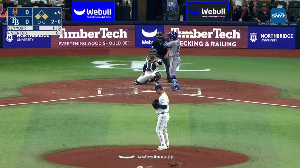 The Mets score a run as Mark Vientos grounds into a double play