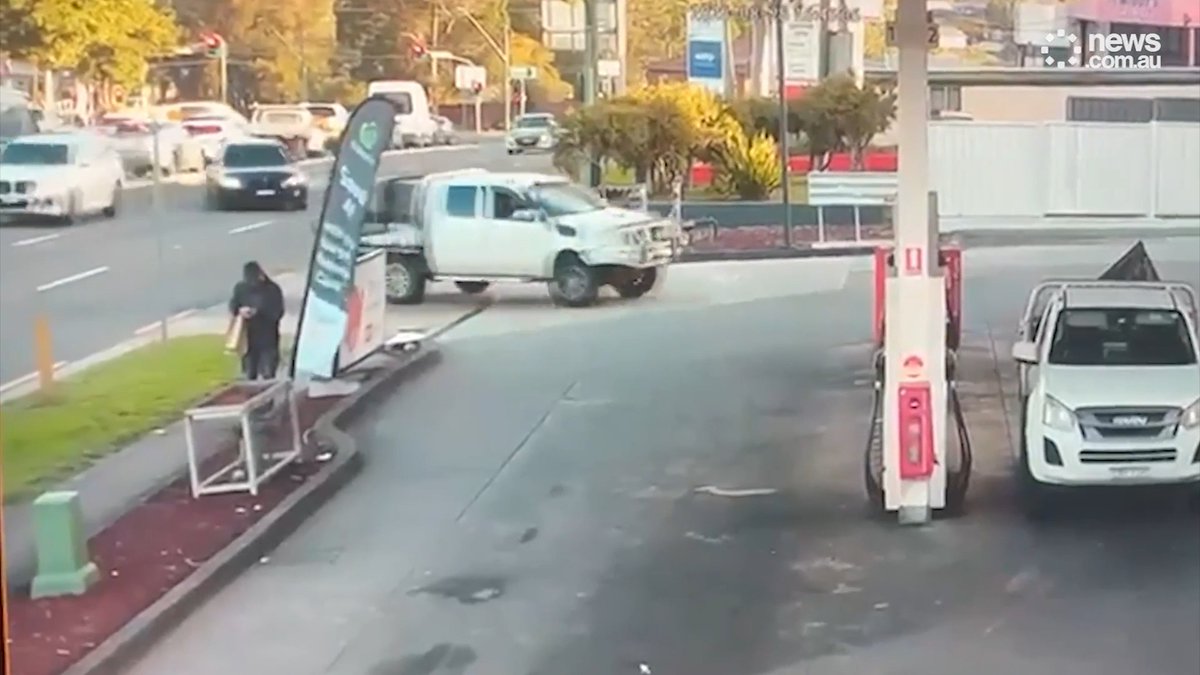 ⚠️ A CRAZY scene played out in Sydney last Friday as a car nearly hit a pedestrian before ramming into a petrol station.