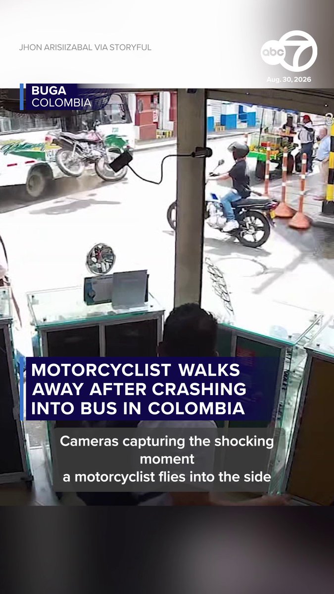 SHOCKING: Video shows the moment a motorbike ran straight into a public bus at an intersection in Colombia. The biker was able to walk away from the crash. Authorities in the city of Buga said they were trying to locate him, but he was not in any hospital.