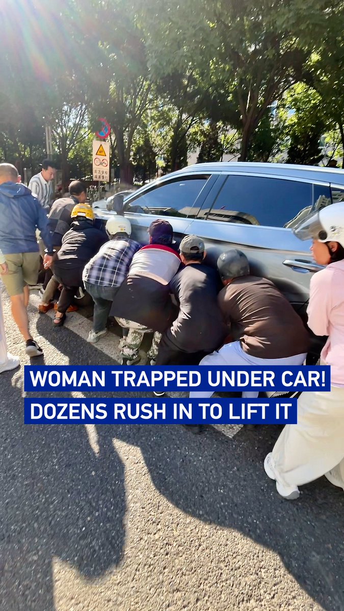 Woman trapped under car! Dozens rush in to lift it
