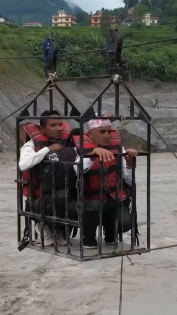 Authorities in Nepal set up a temporary zip line across the Trishuli River to help people cross after the catastrophic floods damaged bridges and roads. The zip has been set up by the Nepal's army and police, officials said.