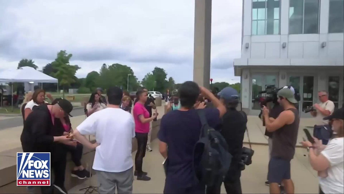 WATCH: Tensions boil over outside the courthouse as spectators react to the Lindsay Clancy trial. A woman dressed in black gets into a heated exchange with a woman wearing pink, telling the crowd she fired her own therapist because she's "one of the 'Patrick did its.'" The confrontation turns into a screaming match with the woman in black insisting, "This is a funeral we're attending. Three babies' lives were lost." State police eventually stepped in and escorted the woman in black away as the confrontation drew attention outside the courthouse.