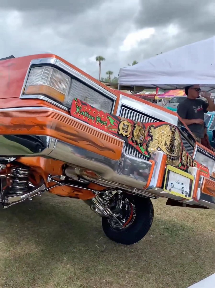 Eddie Guerrero’s legendary lowrider from the cover of a magazine being showcased at a car show 🔥