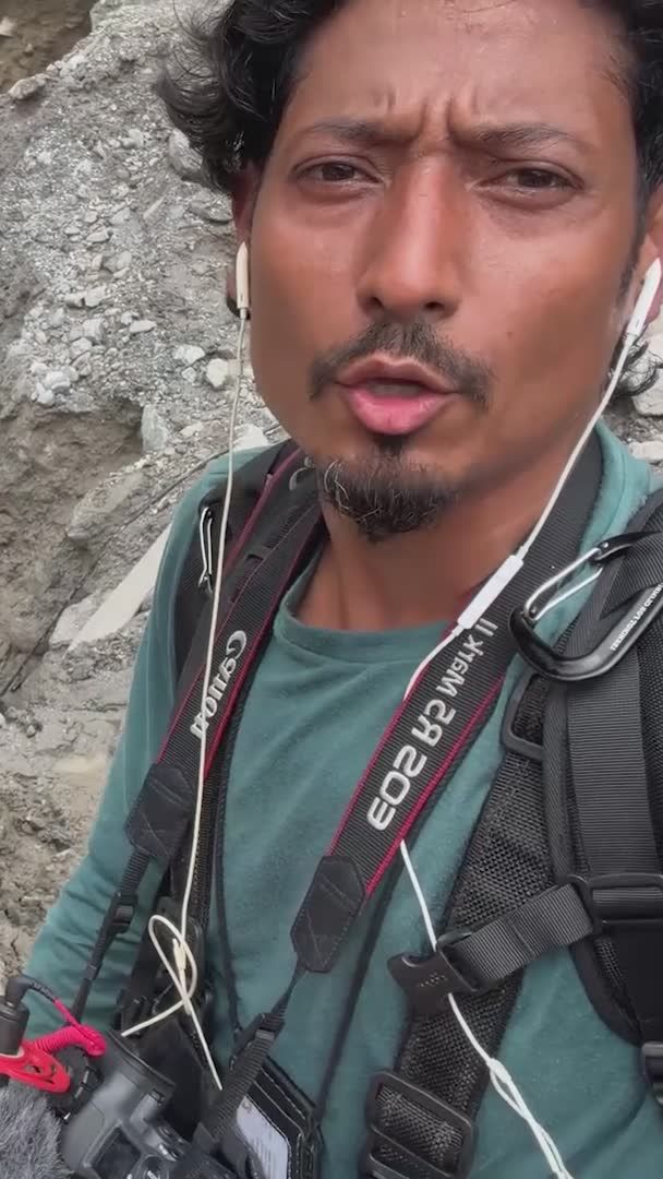 From the air, the section of Nepal's Trishuli River valley, where rescuers are trying to reach hundreds of workers trapped in hydroelectric power plants, emerges as a desolate grey expanse. Arriving by helicopter, Reuters photographer Navesh Chitrakar gives you an on-the-ground look at the rescue efforts.