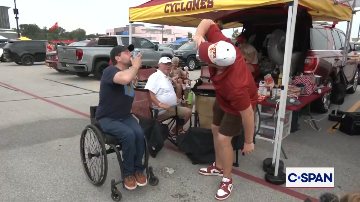 U.S. Senate Candidate Josh Josh Turek shotguns a beer with voters at tailgate party.