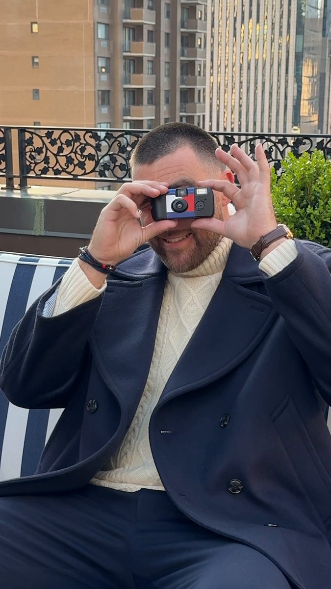 what happens when you hand Travis Kelce a disposable camera on set? Travis Kelce