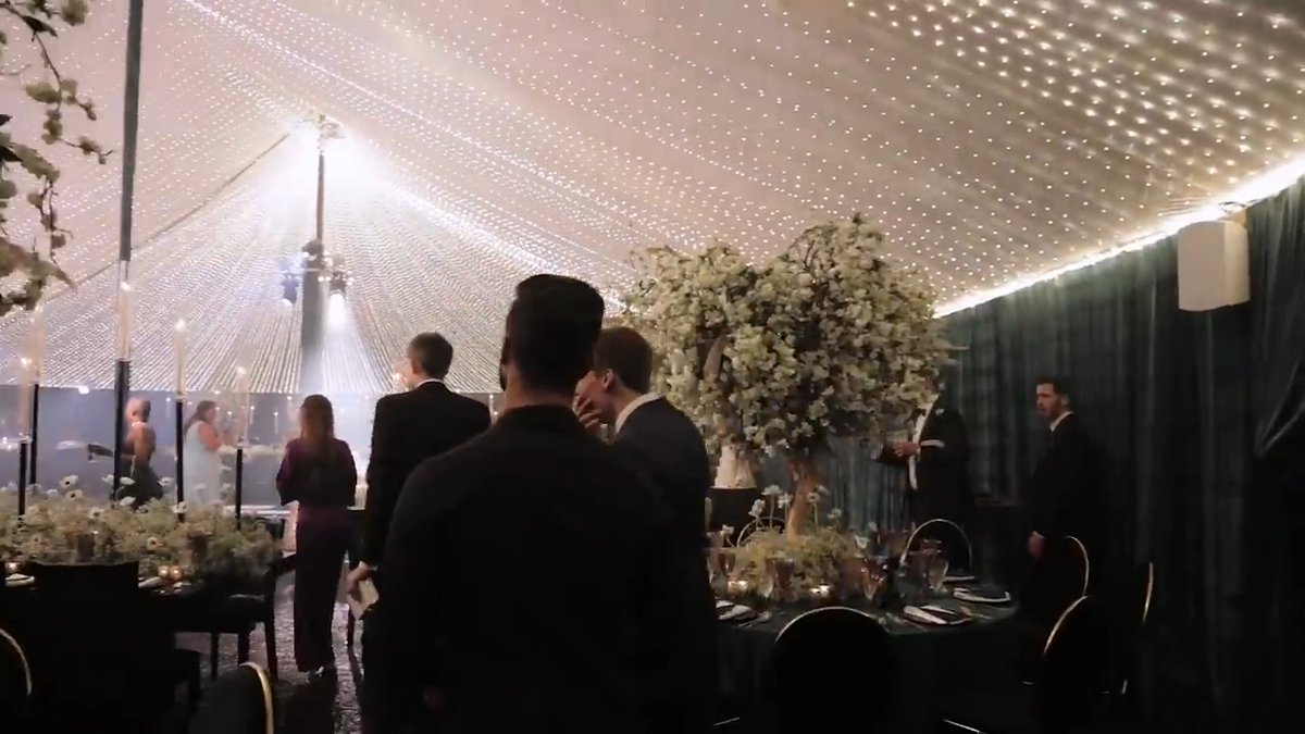 THIS IS THE KIND OF WEDDING VIDEO THAT MAKES “HAPPY FOR YOU” FEEL WAY TOO SMALL. Forget the decorations for a second. The thing that hits hardest is seeing these two men go from getting ready, to walking through that beautiful outdoor setting, to finally celebrating together surrounded by everyone they love. And then that dance-floor moment comes in and completely changes the energy. They didn’t just make a wedding video. They captured a whole chapter of their lives. And THAT’S why wedding footage like this hits differently. Years from now, they’ll be able to watch these exact moments and remember not just how the day looked… but exactly how it felt.