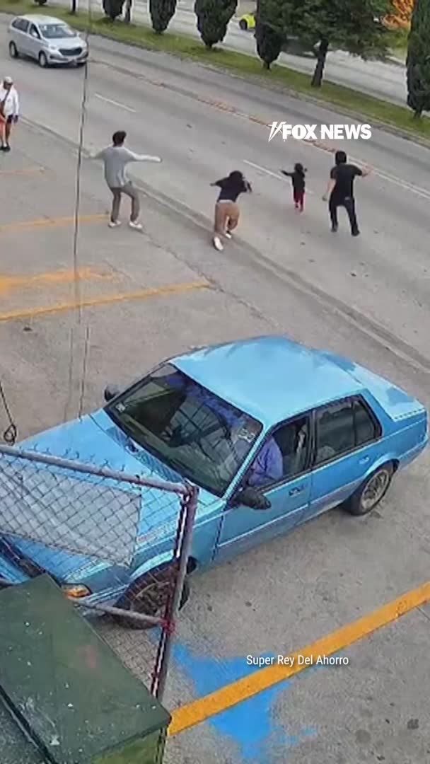 WATCH: A supermarket manager drops everything and races into traffic to save a little girl who runs into the path of an oncoming car in Mexico. Heart-stopping security video shows Luis Cruz catch up to the child just as the car approaches, pulling her out of danger before rolling with her to the side of the road. The supermarket is now honoring Cruz for his quick reaction, naming him Manager of the Year and presenting him with a 20,000-peso award.