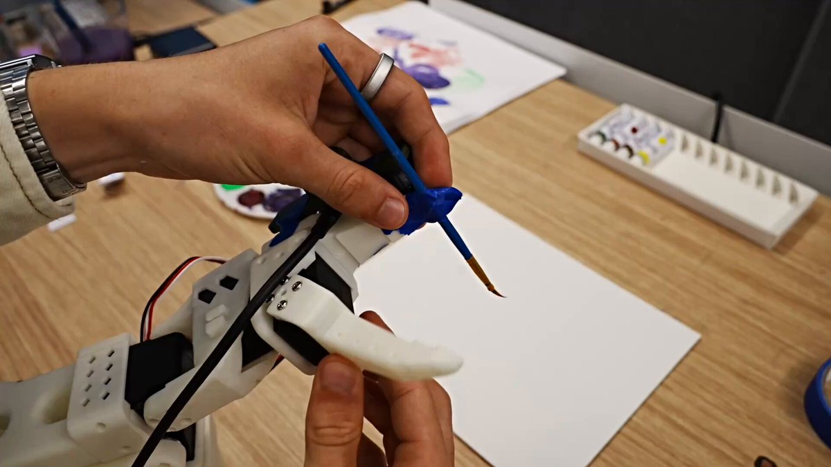 i gave astra a robot, a paint brush, and a camera then asked it to paint the golden gate bridge in real life! it figured out how to control the robot, and progressively got better throughout its attempts. the timelapse is sick