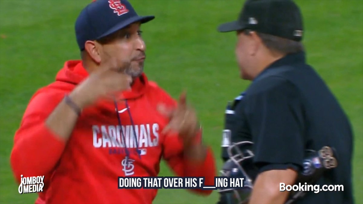 Umpire Doug Eddings tells Cardinals rookie Hancel Rincón to fix his hat, a breakdown