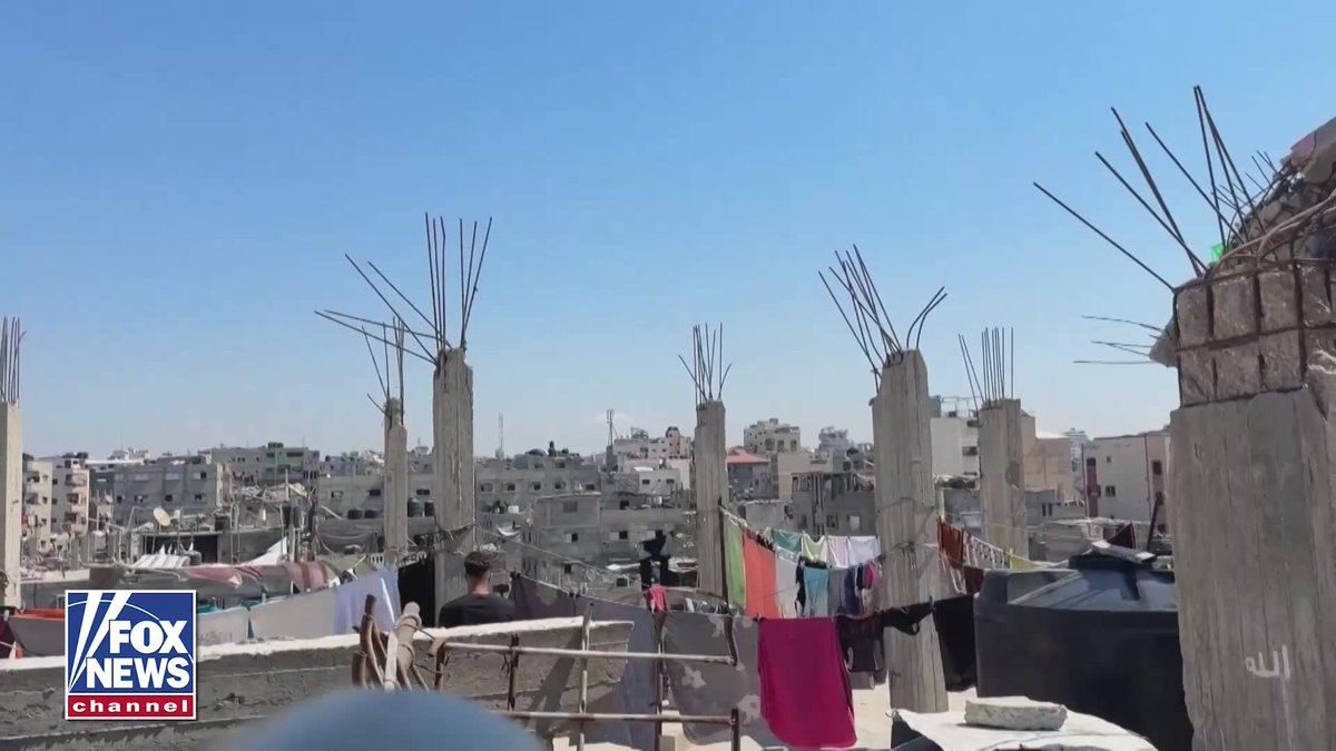WATCH: Smoke and flames erupt from a house in Gaza City's Al-Shati refugee camp after an Israeli strike hits the building. Residents say the strike came after the Israeli military warned people to evacuate the area. There are no immediate reports of casualties.