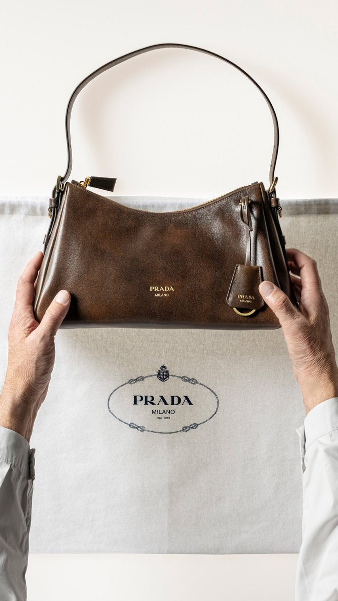 Prada Antique: time, craftsmanship and perception converge. Crafted in antiqued leather, the Prada Aimée reveals a lighter, more luminous femininity. Discover more: #PradaFW26 #Prada