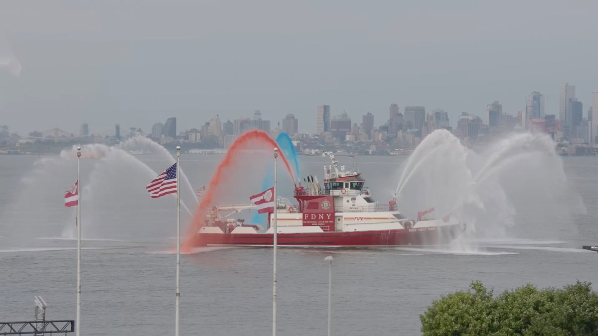 The FDNY Choir performs "God Bless America" as Marine Units conduct a water salute at the 2026 FDNY World Trade Center Memorial Service on Staten Island: