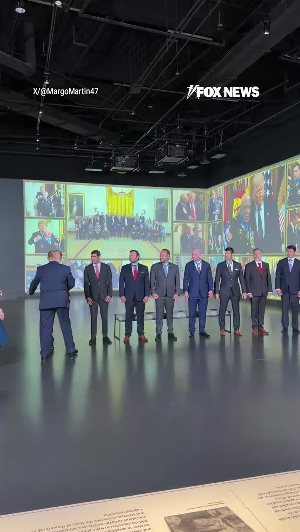 President Trump greets Medal of Honor recipients during a visit to the National Medal of Honor Museum in Arlington, Texas. The president toured the museum and met with American heroes ahead of the second night of the Republican midterm convention in Dallas.