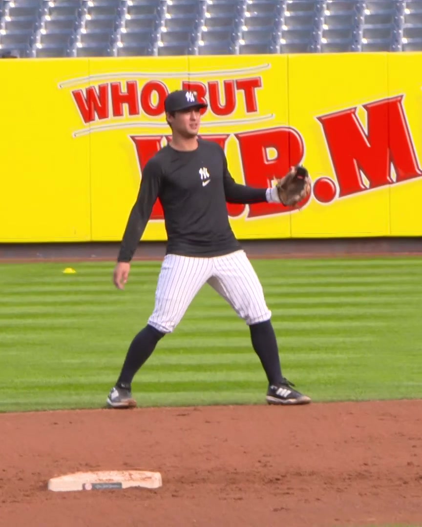 Anthony Volpe takes grounders at second base