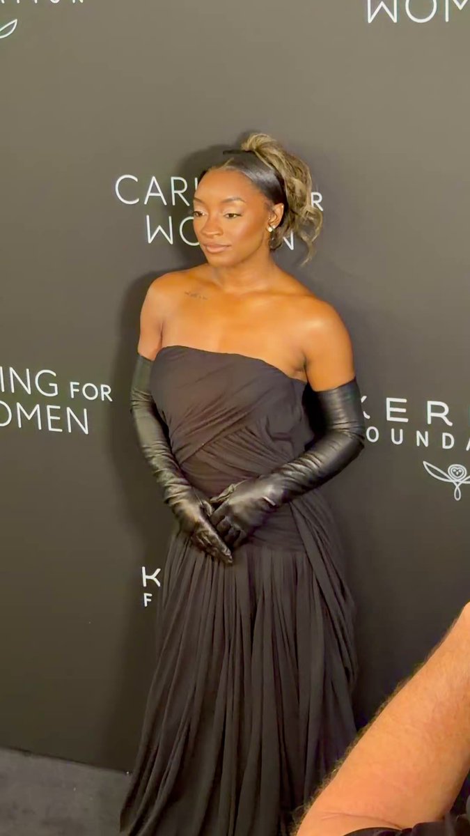 Simone Biles poses at Kering’s Caring for Women Dinner at #NYFW