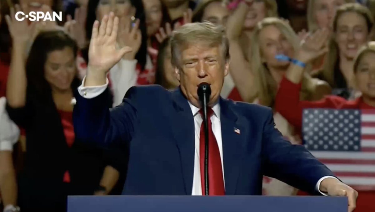 Trump conducts a cult ritual forcing his supporters to hold up their hands and pledge loyalty to him: “I pledge to the greatest President in the history of the United States… So help me God.”