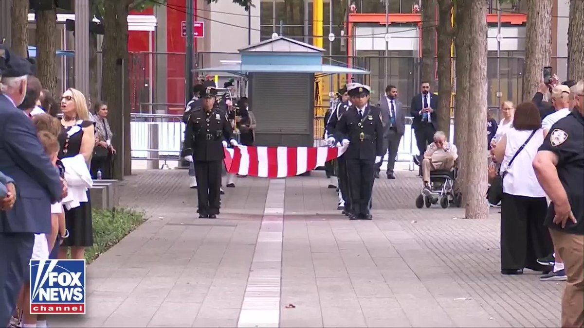 NOW: The 9/11 commemoration at Ground Zero in New York City begins with officers carrying the American flag in a solemn procession.